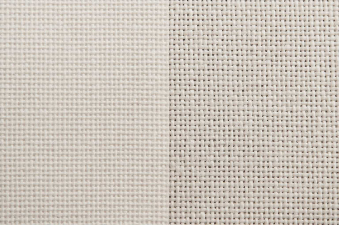 A side by side painting canvas comparison showing linen and cotton canvas.