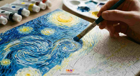 Person painting 'Starry Night' with a brush on a canvas, surrounded by art supplies.