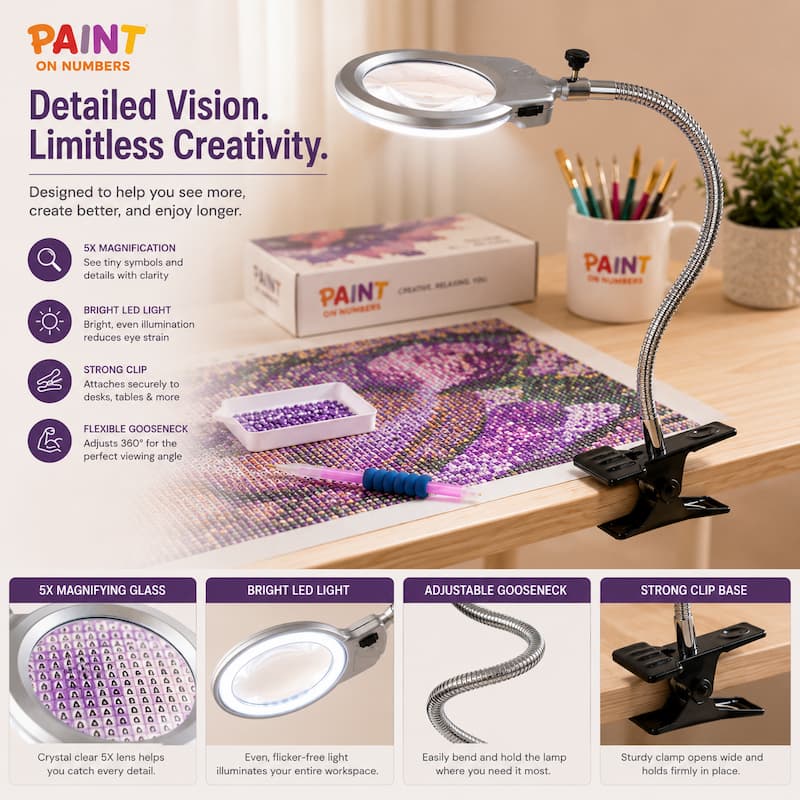 A PAINT On Numbers 5X magnifying lamp with a bright LED light and flexible gooseneck, shown clipped to a desk in a workspace setting with a paint palette and paint box.
