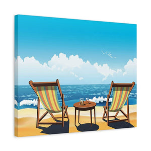 Two striped beach chairs and a small table with drinks on a sandy beach facing the ocean under a bright blue sky shown in a frame