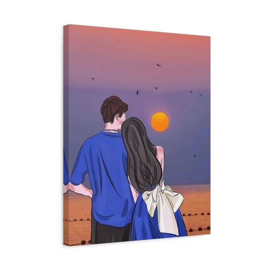 Couple in blue outfits watching sunset over ocean – paint by numbers artwork shown in a frame.
