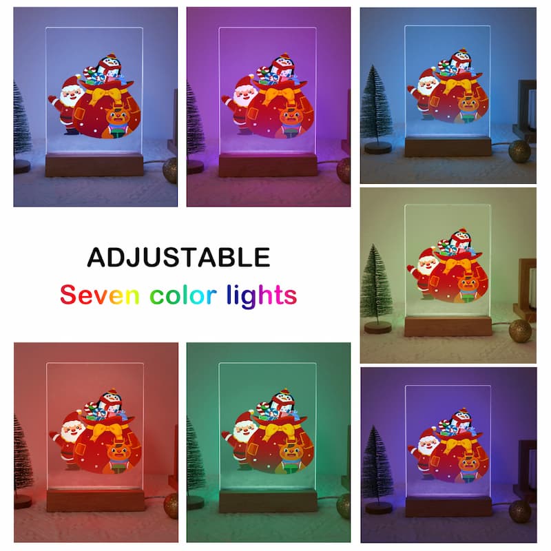 A collage showing a Christmas-themed LED light box in seven different color modes, with Santa Claus and penguins riding a sleigh. The collage includes a central text panel that reads 'ADJUSTABLE Seven color lights'.