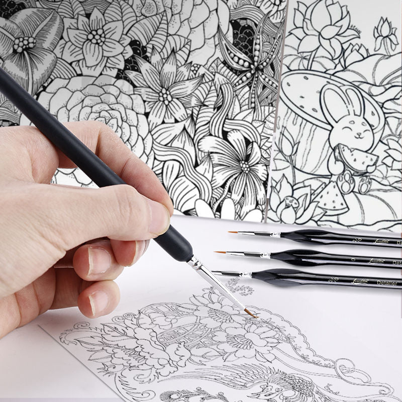 Hand holding a pen over a coloring book with intricate designs and additional pens on a white surface.
